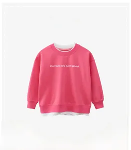 Detail of pink faux layered sweatshirt with white collar and letter print for kids