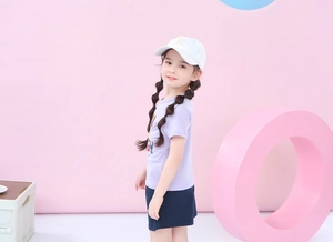 Detail of girls summer outfit featuring lilac cotton T-shirt and navy blue sports shorts