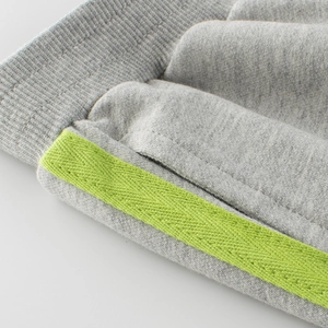 Girls' grey sports pants with green side stripes and elastic waistband for casual wear