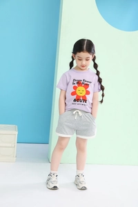 Detail of girl's purple sunflower t-shirt and grey shorts set with elastic drawstring waist