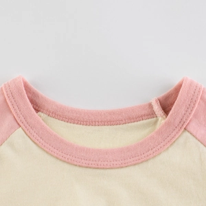 Girl's raglan sleeve T-shirt with cartoon bear design in pink and cream color