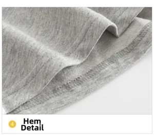 Dettaglio dell'orlo in cotone spugna grigio con cuciture piatte su pantaloncini da bambina