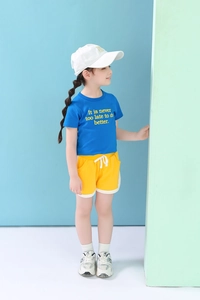 Girl's summer outfit featuring blue short-sleeve T-shirt and yellow drawstring shorts