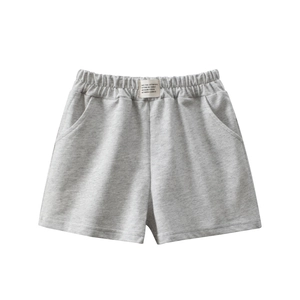 Girls gray cotton sports shorts with elastic waistband and decorative patch