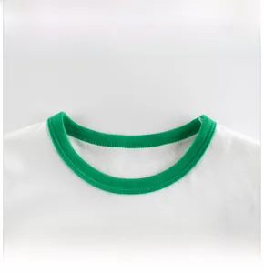 Close-up detail of green ribbed crew neck collar and cotton stitching on kids t-shirt