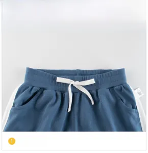Detailed macro view of girls' navy cotton shorts waist with elastic band and drawstring