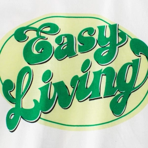 Kids white cotton T-shirt featuring green Easy Living vintage puff print details