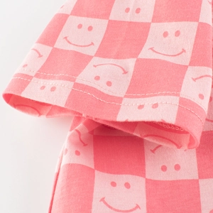 Pink checkered girl's T-shirt with smiley faces and double-needle cuff stitching