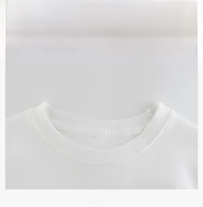 Detail shot of the reinforced ribbed neckline on a premium white cotton kids' t-shirt