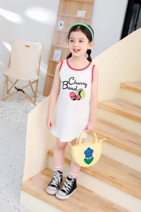 Detail of girls' white sleeveless cotton dress featuring cherry print and red trim