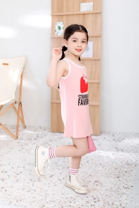 Detailed close-up of pink cotton girl dress with a red strawberry print and white trim