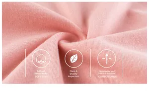 Macro shot of breathable pink knit cotton fabric showing soft texture and A-class quality
