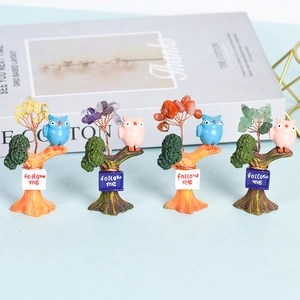 Four colorful owl crystal stone trees with follow me signs on resin bases for home decor
