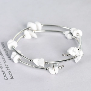 Double-layer silver bangle with natural white marble stone chips in a modern minimalist style