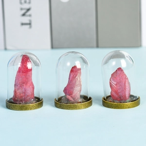 Three natural pink crystal ore specimens in glass domes with vintage brass bases