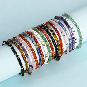 Handmade beaded bracelet with natural tiger eye and agate stones on display stand