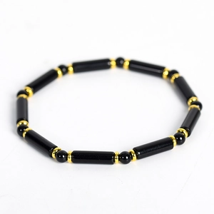 Fashionable braided leather bracelet with black agate beads and gold metal spacers