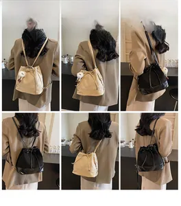 Multi-way styling display of bow bucket bag in black and beige with matte finish