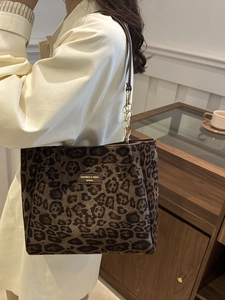 Retro leopard print tote bag with chain strap shown on model for a stylish casual commute