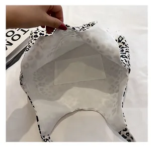 Detail view of large leopard print tote bag interior showing the spacious main compartment