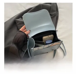 Internal view of a light blue fashion handbag showing large capacity for daily essentials