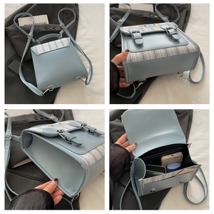 Detail view of small blue plaid backpack showing back straps and internal storage capacity