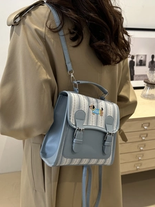 Blue striped small backpack with dog embroidery and adjustable leather strap