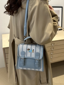 Blue and white striped crossbody bag with puppy embroidery and adjustable strap