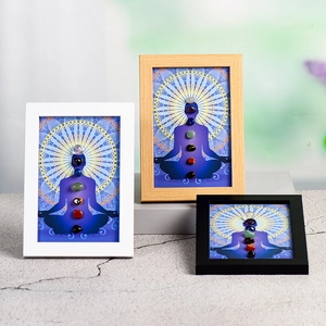Yoga meditation wooden frames with seven chakra natural stones and mandala art patterns