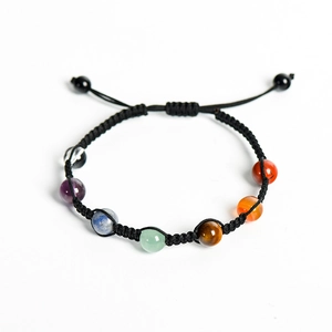 Adjustable black woven rope bracelet featuring seven colorful natural chakra stone beads