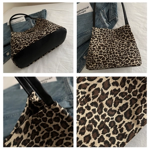 Dettagli del tessuto con stampa leopardata e cuciture della base in pelle della borsa