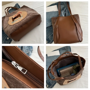Detail view of corduroy tote bag showing metal zipper and large internal storage capacity