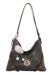 Large grey denim crossbody bag with brown leather trim and white cloud charm accessory