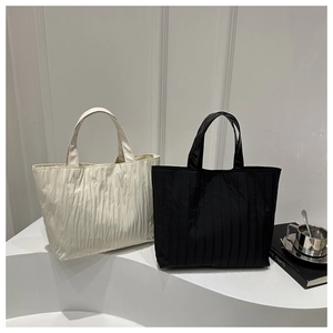 Minimalist pleated tote bags in black and cream white for daily commuting and fashion