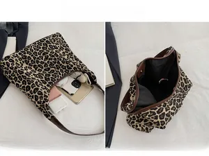 Detailed view of the large leopard print tote bag interior and organizational capacity