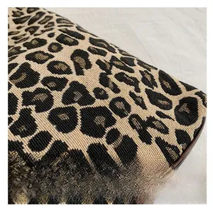 Close-up of leopard jacquard fabric texture on a fashionable tote bag with woven details