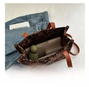 Internal view of leopard print tote bag showing large capacity for daily essentials