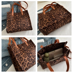 Detail of leopard print tote bag showing large capacity interior and leather handles