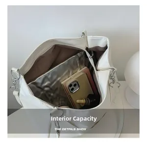 Top view of white tote bag interior showing spacious capacity for tablets and daily essentials