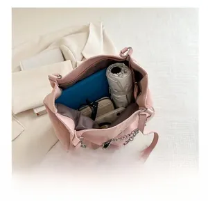 Top view of pink suede tote bag interior showing large capacity for daily essentials