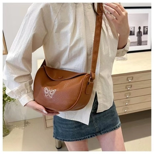 Brown PU leather crossbody saddle bag with butterfly print and adjustable strap
