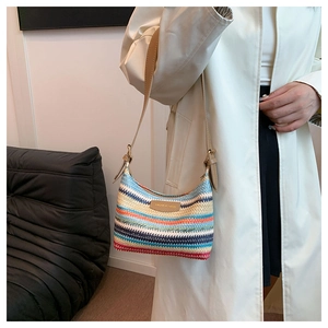 Detail of colorful rainbow woven shoulder bag with FASHION BAGS leather patch and strap