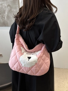 Pink quilted crossbody bag with a cute puppy patch for a stylish fashion look