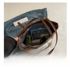 Top view of a spacious tote bag showing interior storage for iPad, umbrella, and wallet