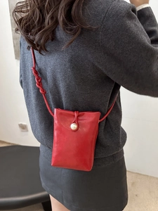Mini red leather mobile phone crossbody bag with pearl button closure and knotted strap