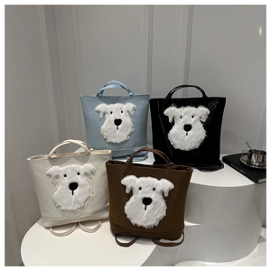 Detail of four colorful tote bags featuring plush Schnauzer 3D animal embroidery designs