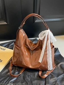 Brown oil wax leather tote bag with lace bow and numeric patch for commuting