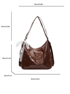 Brown leather tote bag with lace bow and numeric imprint showing full dimensions