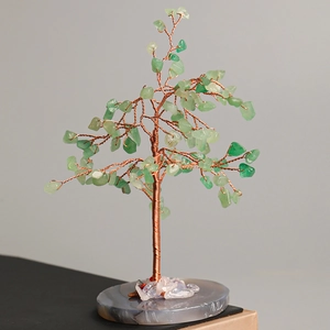 Handcrafted crystal tree ornament with green stone leaves and natural agate base for desk decor