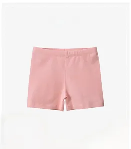Detail view of pink cotton girls' shorts featuring elastic waistband and soft fabric texture